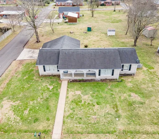 a aerial view of a house with swimming pool