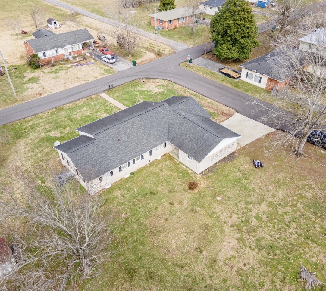 803 Nichols Street Pulaski, TN 38478 - Photo 2 of 8 a view of a swimming pool with an outdoor space
