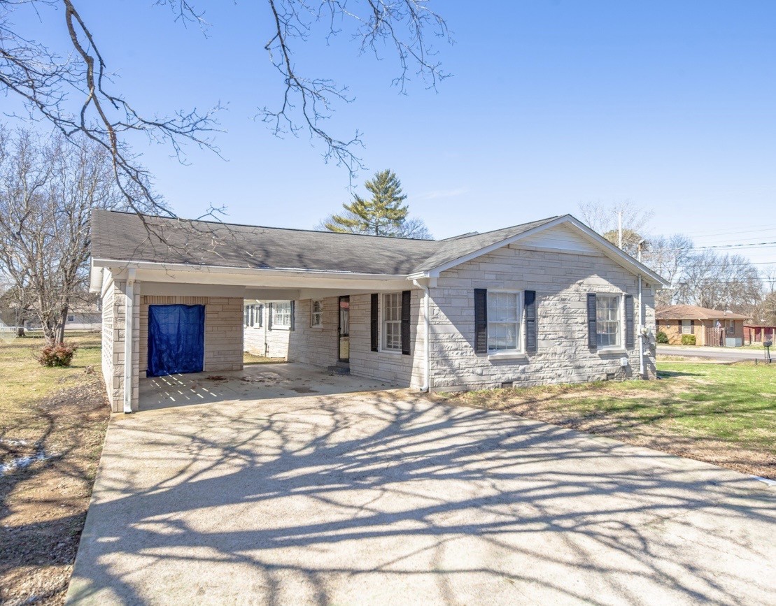 803 Nichols Street Pulaski, TN 38478 - Photo 6 of 8 a front view of a house with a yard