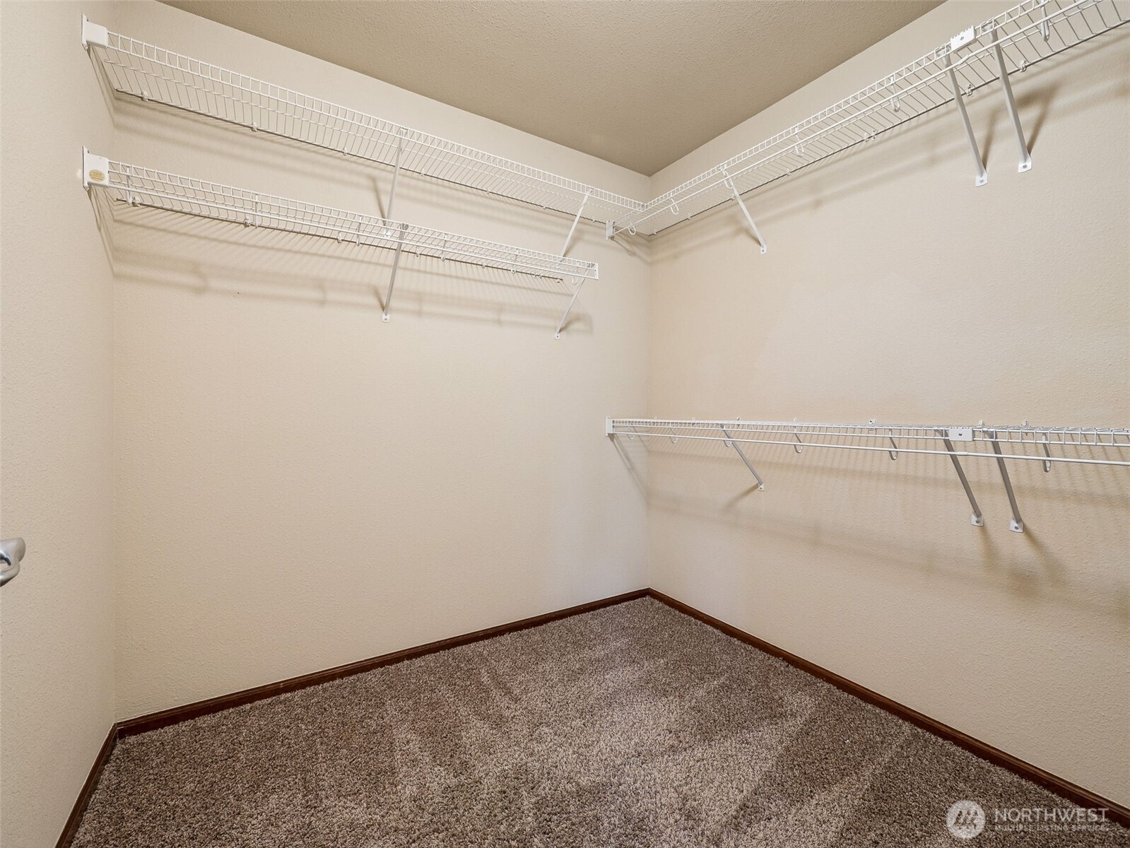 9432 202nd Street East Graham, WA 98338 - Photo 20 of 35 a view of a room with racks on the wall
