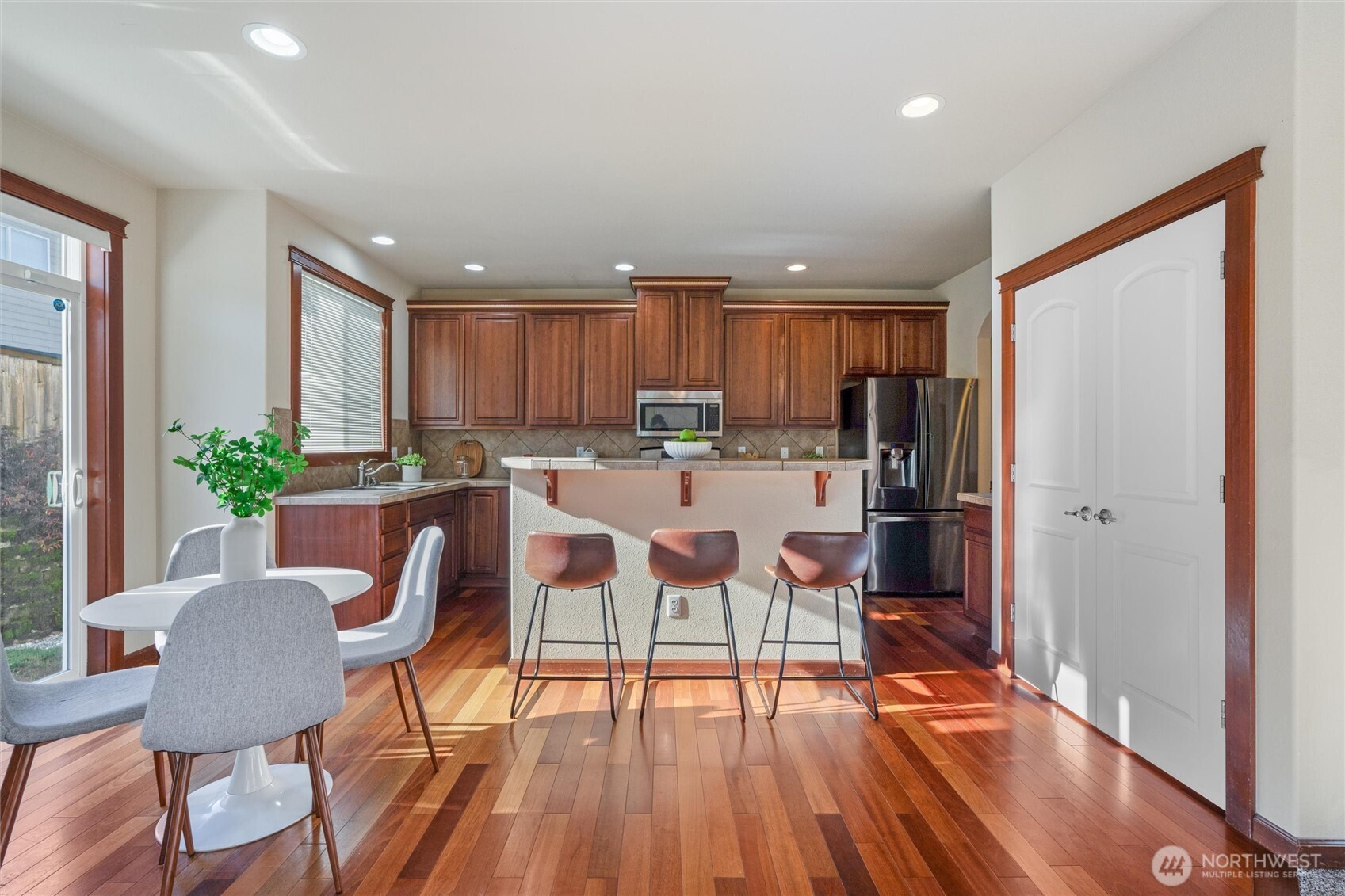 9432 202nd Street East Graham, WA 98338 - Photo 8 of 35 a view of kitchen with cabinets table and chairs