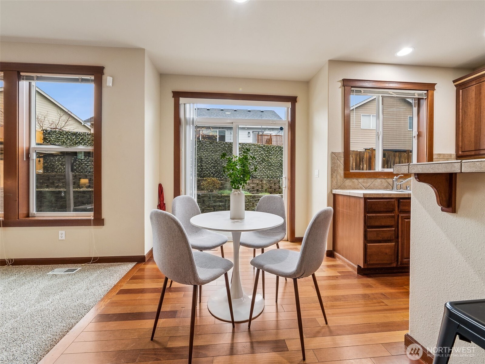 9432 202nd Street East Graham, WA 98338 - Photo 10 of 35 a view of a dining room with furniture window and wooden floor
