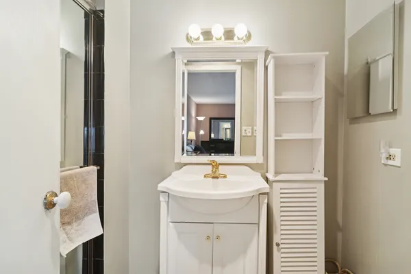a bathroom with a sink and a mirror
