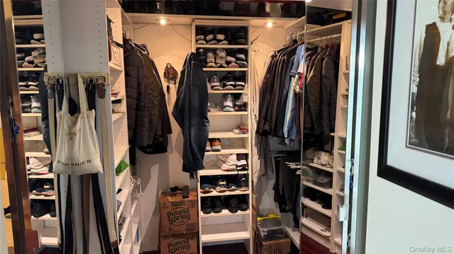 a bedroom with a bed and a mirror