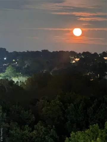 a utility room with dryer washer and stair