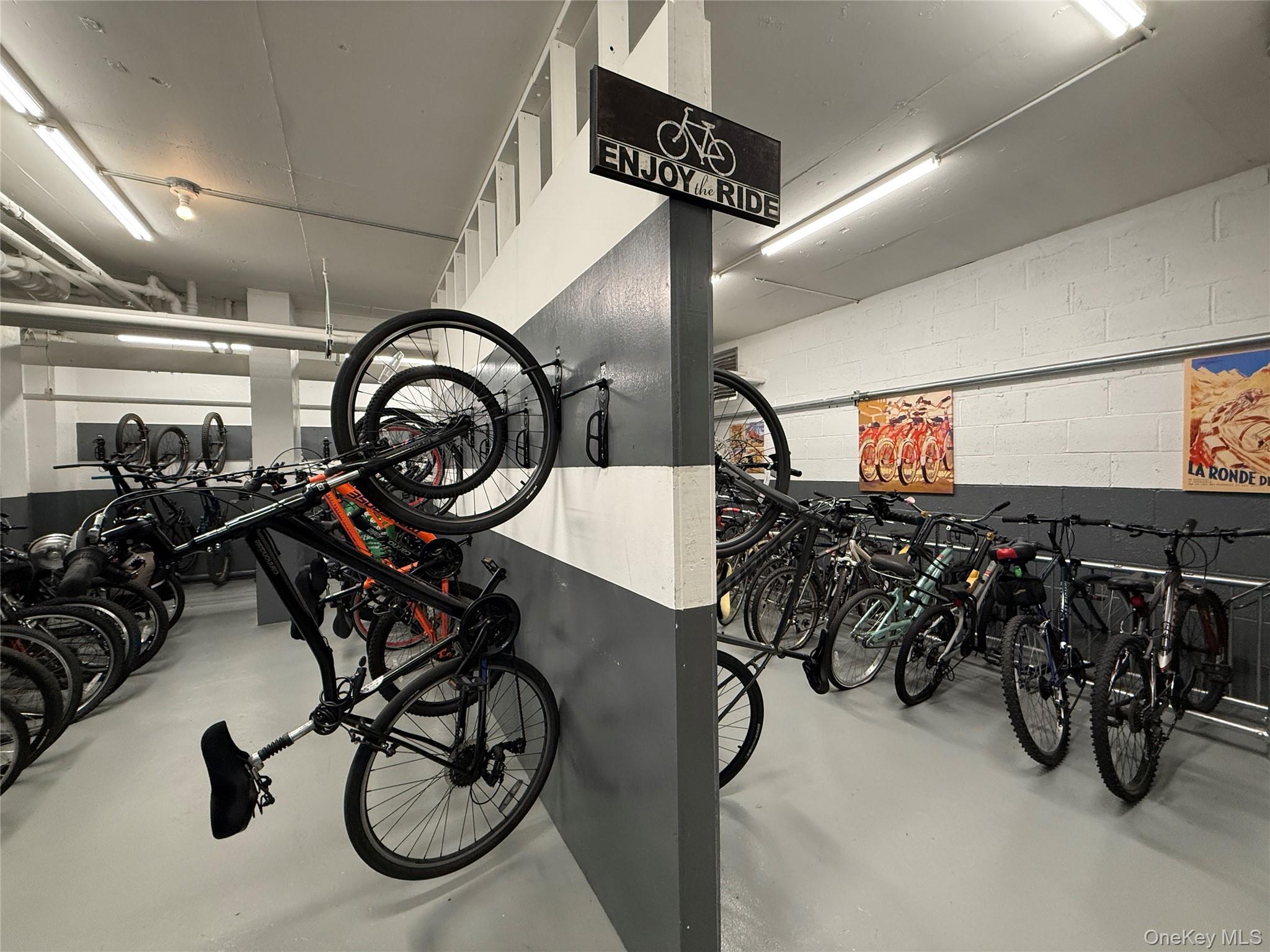 220-55 46th Avenue, Unit 10D Queens, NY 11361 - Photo 25 of 32 Garage featuring bike storage and concrete block wall
