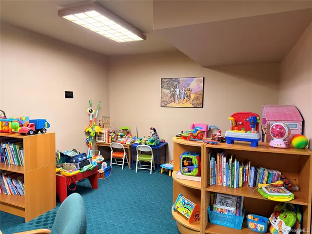 a view of parking garage with cars parked