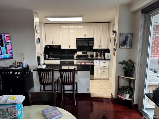 a kitchen with granite countertop a stove and a refrigerator