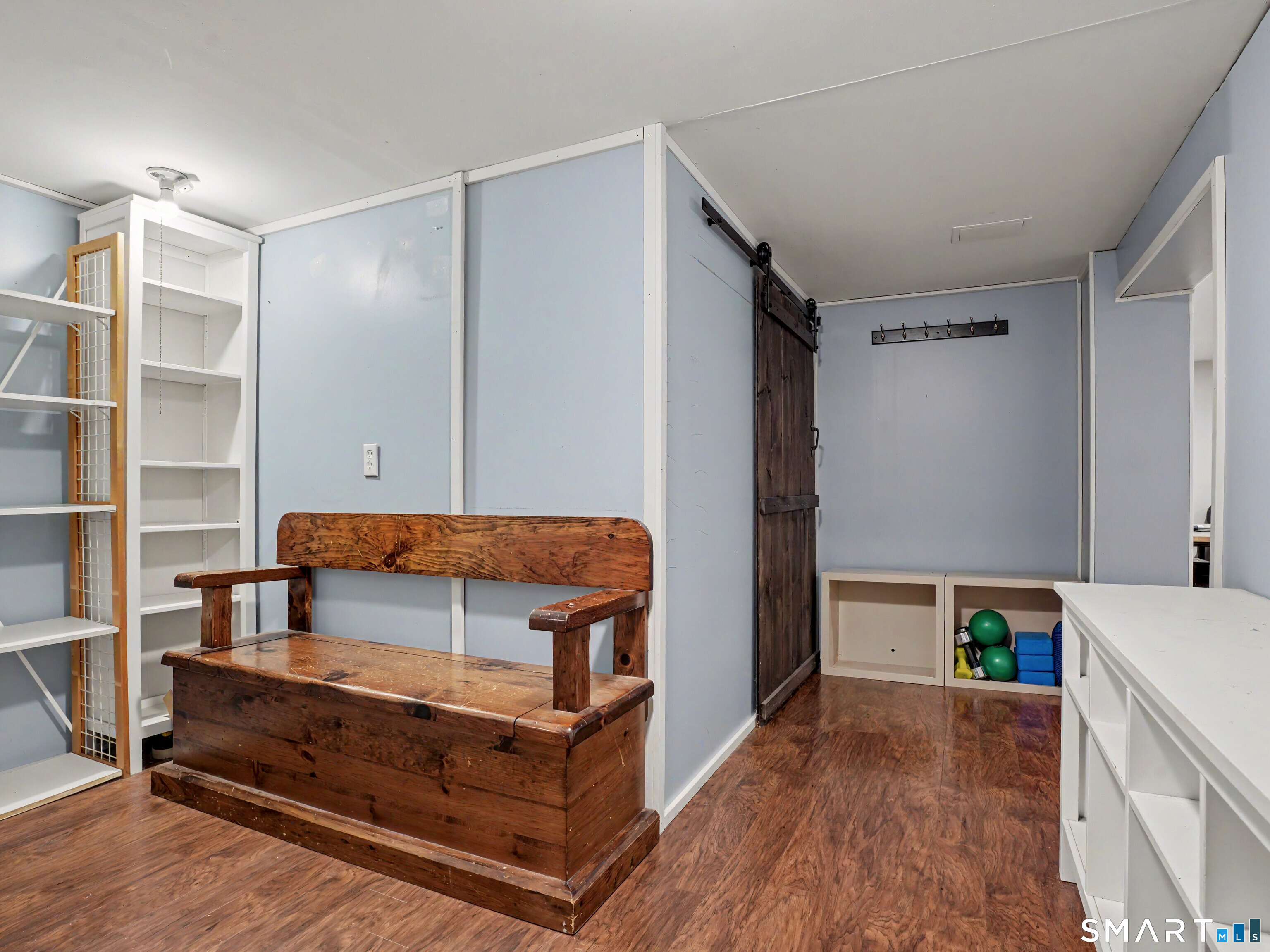 252 Bennetts Farm Road Ridgefield, CT 06877 - Photo 24 of 40 The functional lower walk-out level features a custom Mud Room & a laundry/storage area with a charming barn door.