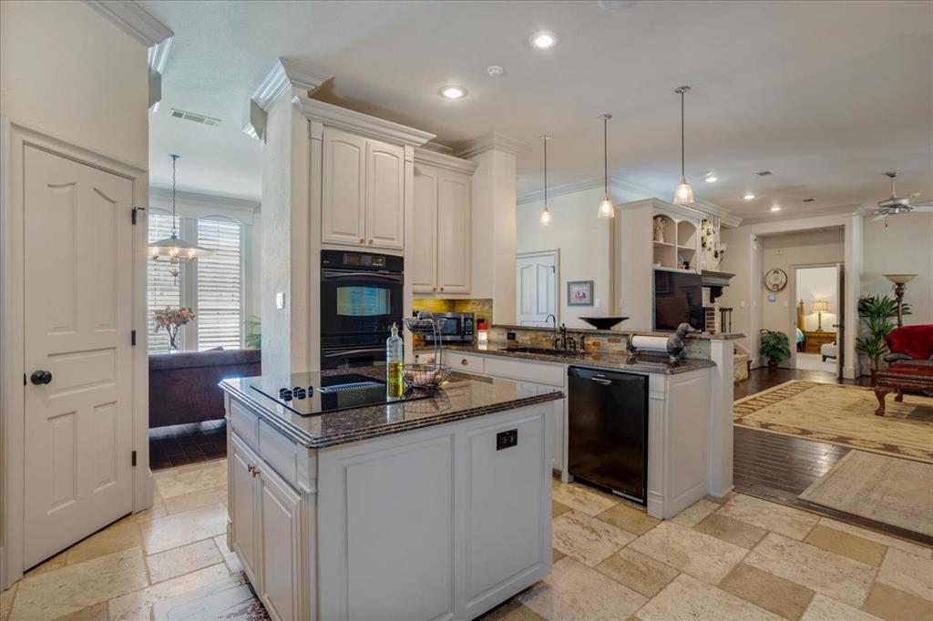 3001 Canyon Creek Drive Sherman, TX 75092 - Photo 11 of 37 a kitchen with kitchen island granite countertop lots of counter top space