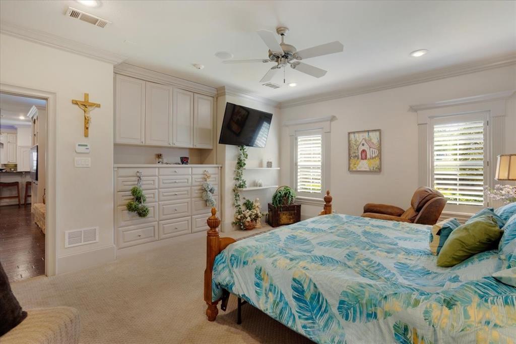 3001 Canyon Creek Drive Sherman, TX 75092 - Photo 18 of 37 a bed room with a bed and a chandelier