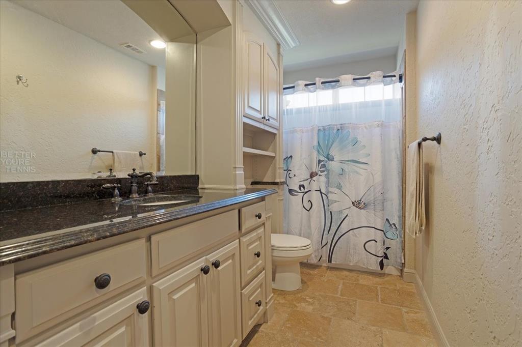3001 Canyon Creek Drive Sherman, TX 75092 - Photo 20 of 37 a bathroom with a double vanity sink mirror and toilet