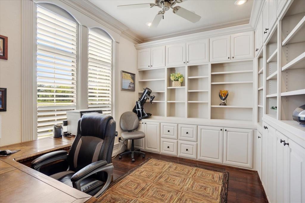 3001 Canyon Creek Drive Sherman, TX 75092 - Photo 23 of 37 a kitchen with granite countertop a stove a sink and white cabinets