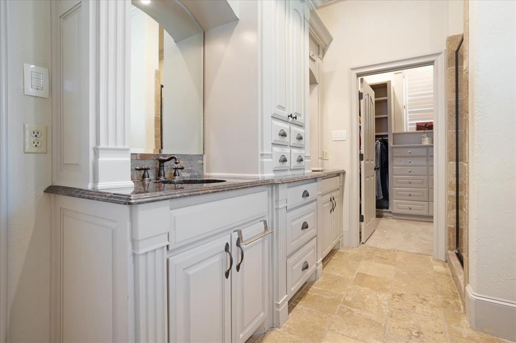 3001 Canyon Creek Drive Sherman, TX 75092 - Photo 27 of 37 a spacious bathroom with a double vanity sink and a mirror