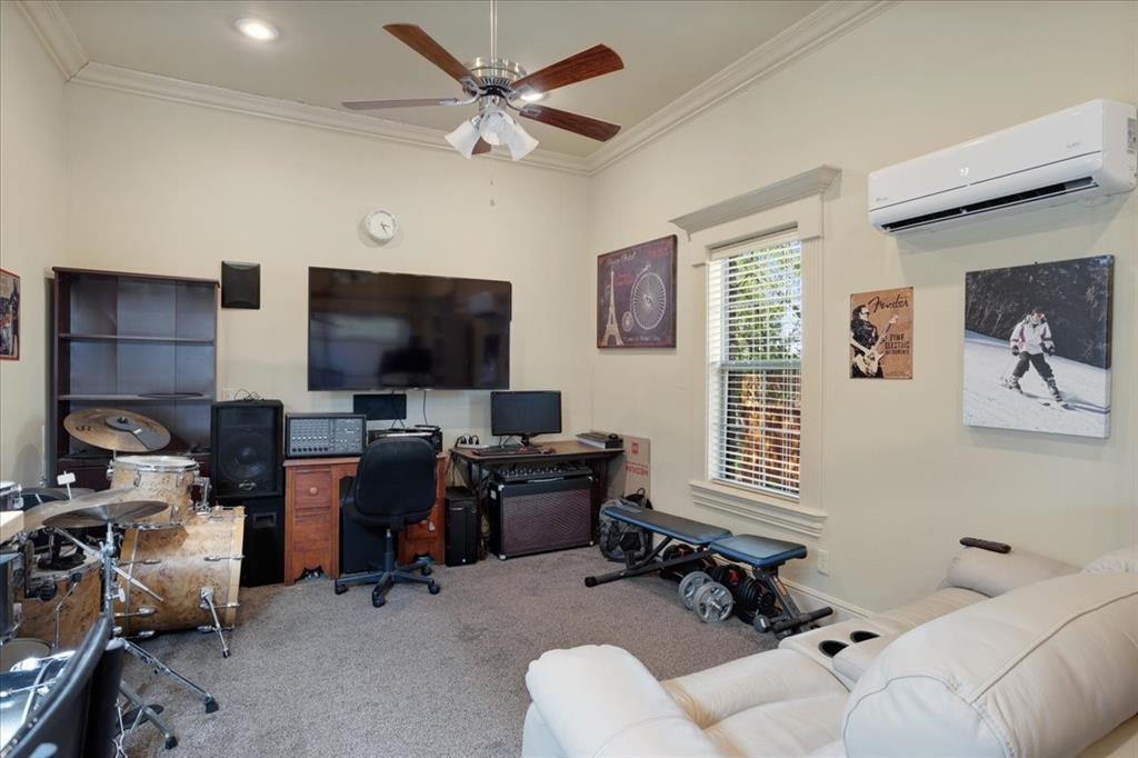 3001 Canyon Creek Drive Sherman, TX 75092 - Photo 30 of 37 a livingroom with workspace and a couch