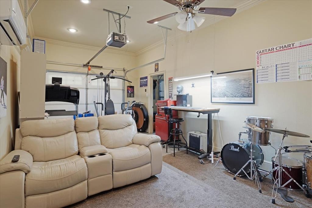3001 Canyon Creek Drive Sherman, TX 75092 - Photo 31 of 37 a living room with furniture and a chandelier