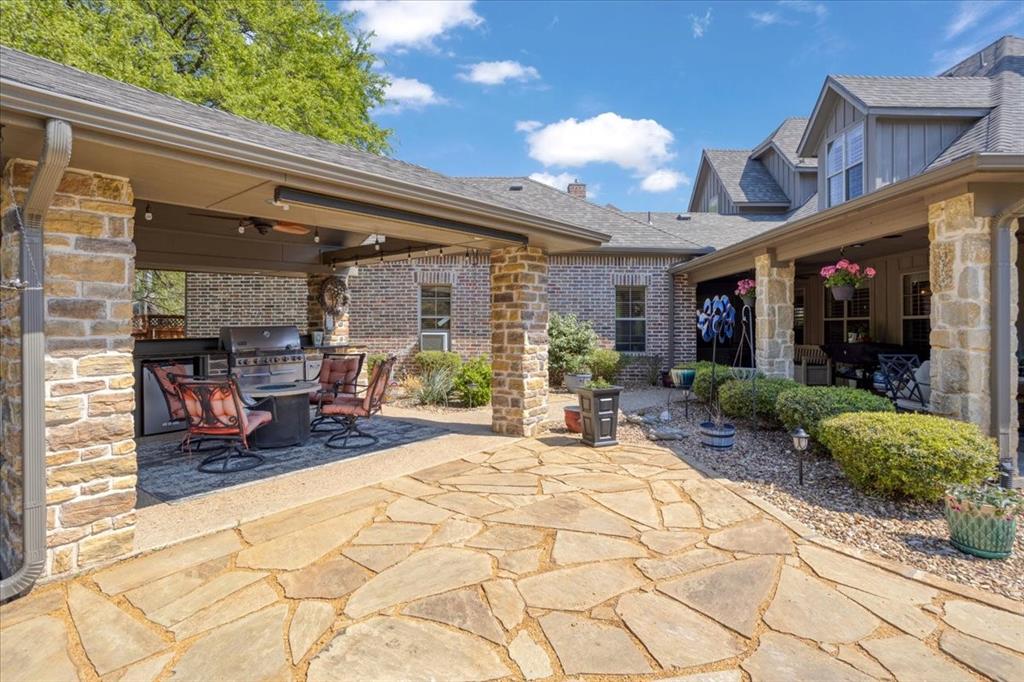 3001 Canyon Creek Drive Sherman, TX 75092 - Photo 33 of 37 a view of a chairs and table in a patio