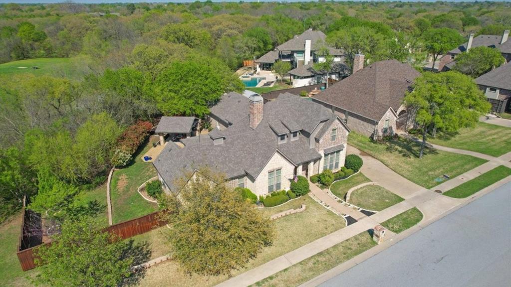 3001 Canyon Creek Drive Sherman, TX 75092 - Photo 6 of 37 an aerial view of a house with a yard and lake view