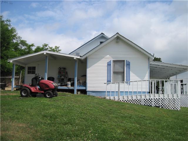 6416 Prospect Road Prospect, TN 38477 - Photo 1 of 9 a front view of house with a garden