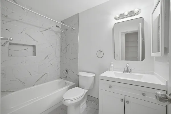 a bathroom with a shower and a toilet