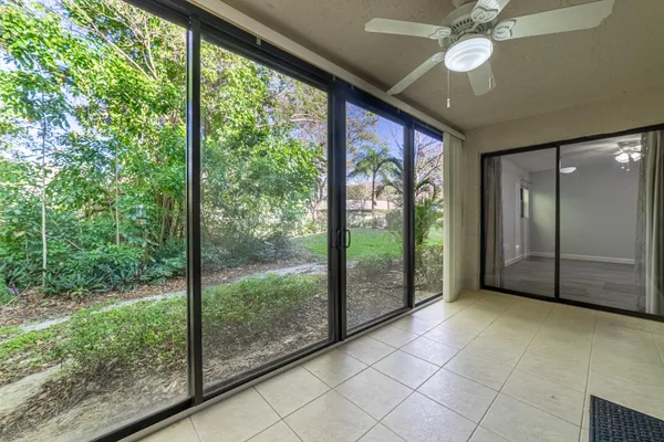 a sign board with yard in the back