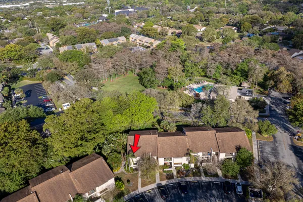 an aerial view of residential houses with outdoor space