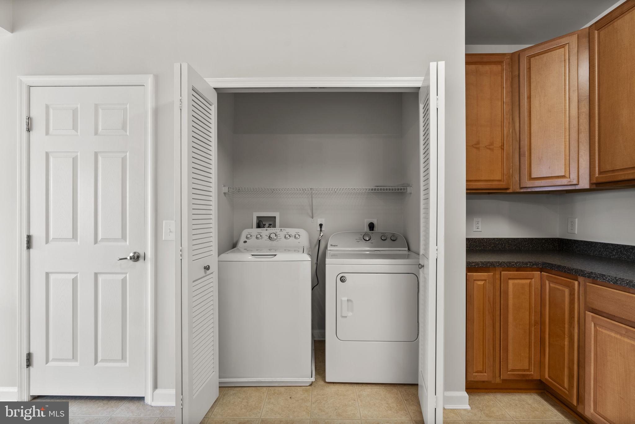 1622 Hardwick Court, Unit 201 Hanover, MD 21076 - Photo 12 of 42 a utility room with dryer and washer