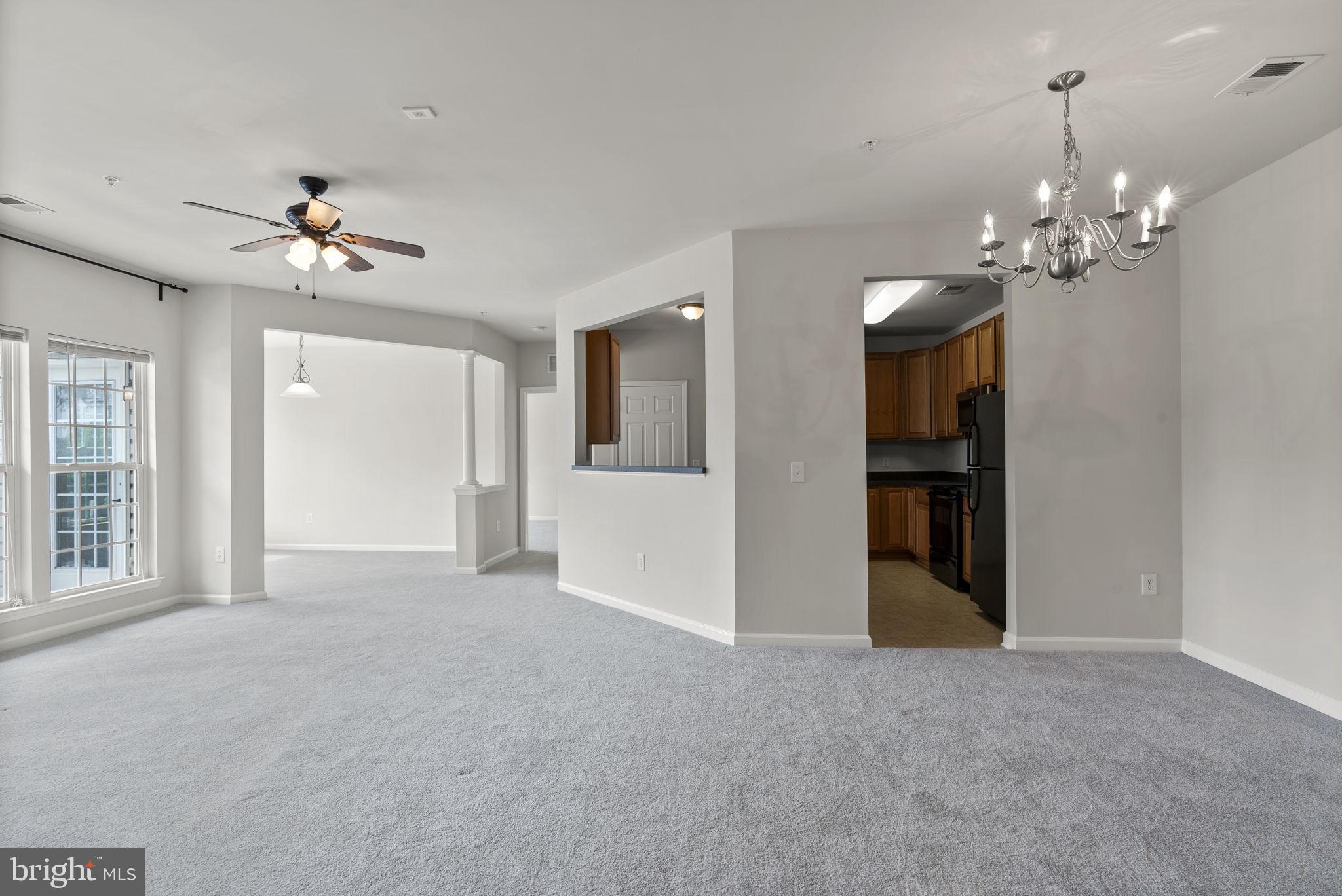 1622 Hardwick Court, Unit 201 Hanover, MD 21076 - Photo 16 of 42 a view of a room with a stylish ceiling fan and entryway