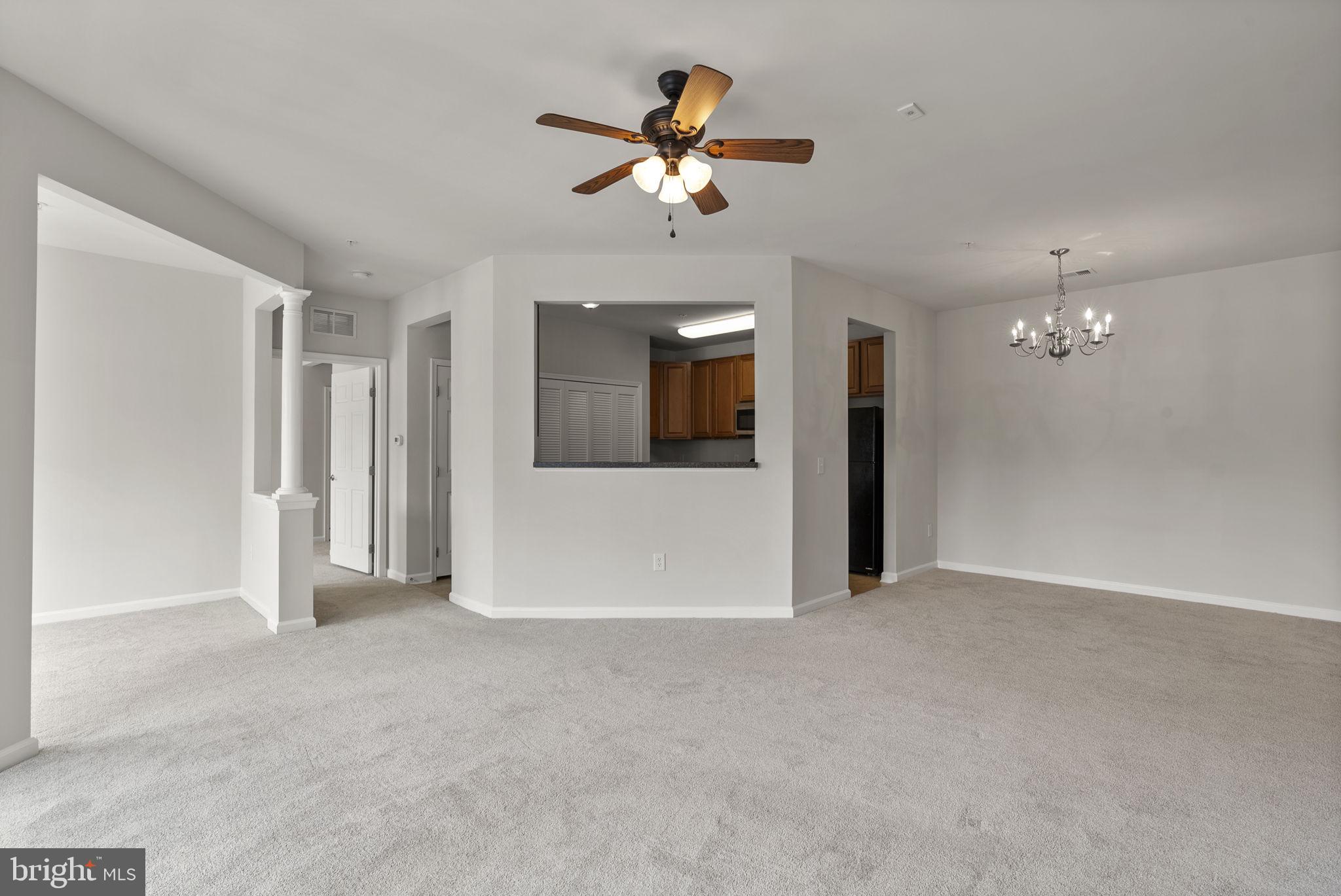 1622 Hardwick Court, Unit 201 Hanover, MD 21076 - Photo 20 of 42 a view of an empty room with a ceiling fan