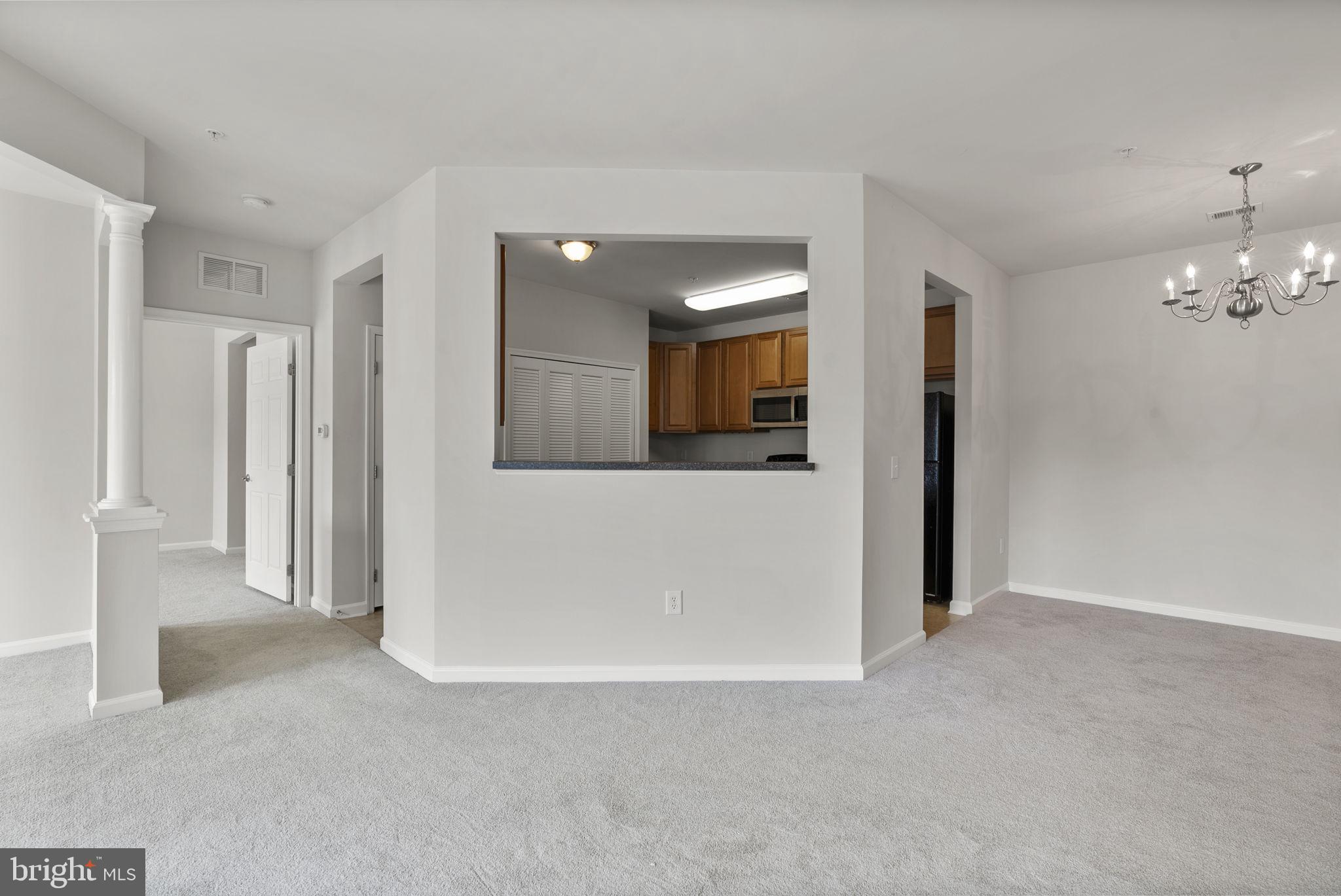 1622 Hardwick Court, Unit 201 Hanover, MD 21076 - Photo 22 of 42 a view of a big room with closet and mirror