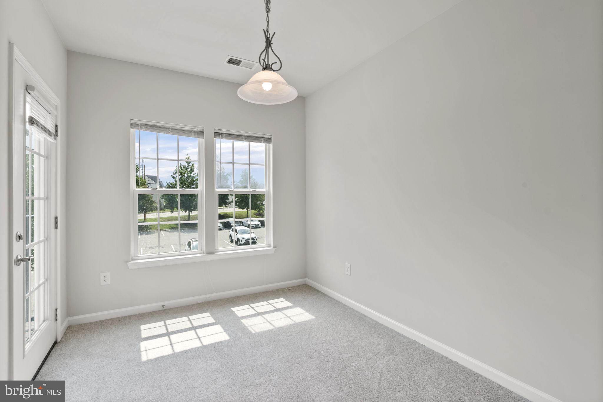 1622 Hardwick Court, Unit 201 Hanover, MD 21076 - Photo 23 of 42 a view of an empty room with a window