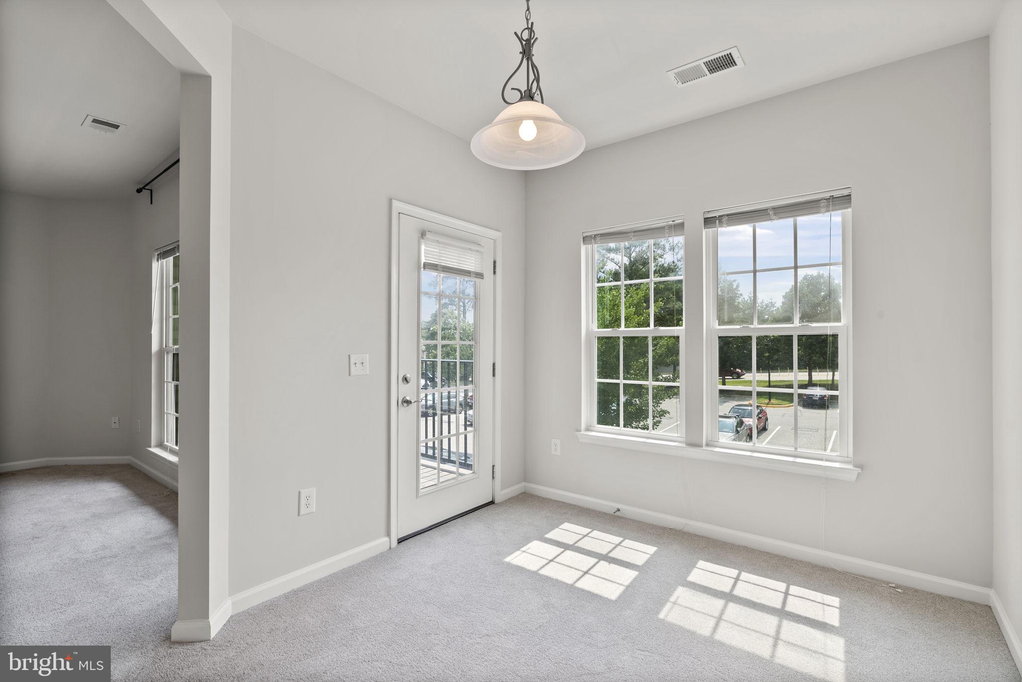 1622 Hardwick Court, Unit 201 Hanover, MD 21076 - Photo 24 of 42 a view of an empty room with a window