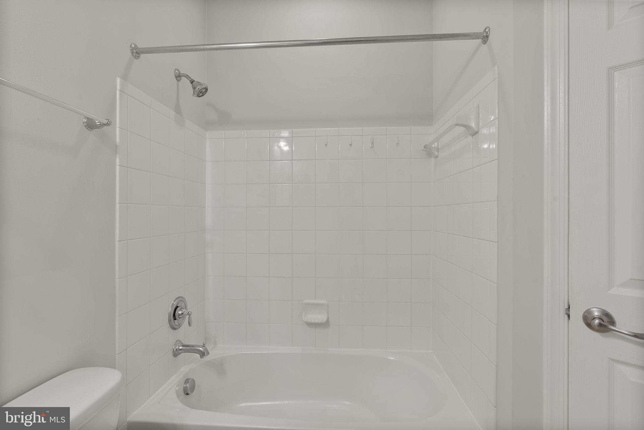 1622 Hardwick Court, Unit 201 Hanover, MD 21076 - Photo 27 of 42 a bathroom with a shower and a bath tub