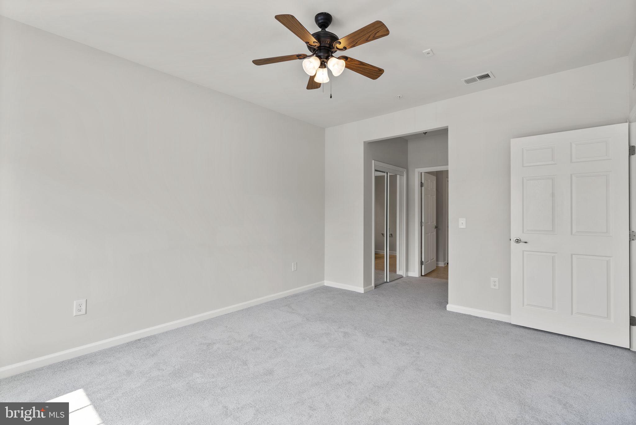 1622 Hardwick Court, Unit 201 Hanover, MD 21076 - Photo 32 of 42 a view of a livingroom with a ceiling fan