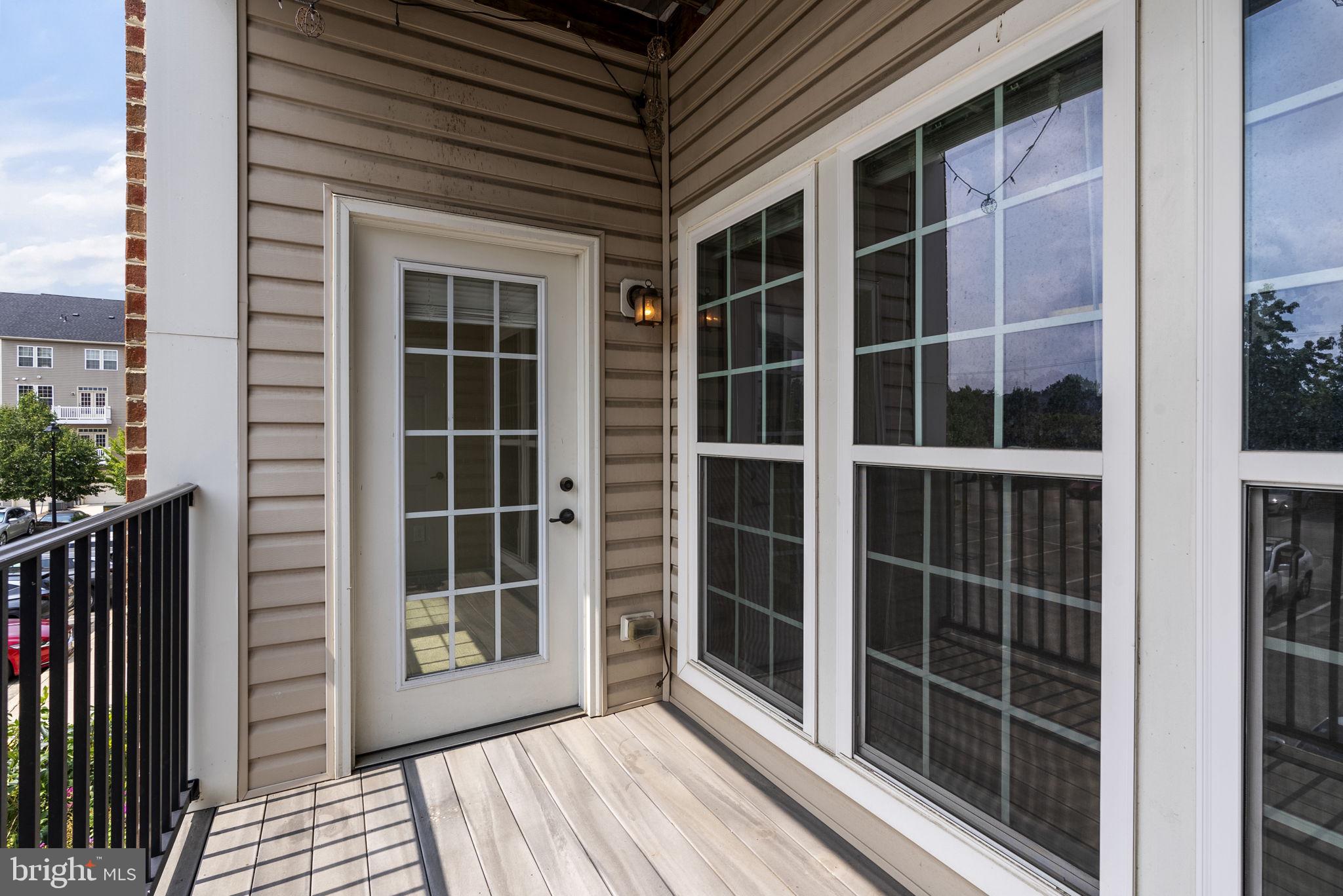 1622 Hardwick Court, Unit 201 Hanover, MD 21076 - Photo 41 of 42 a view of front door with wooden floor and windows