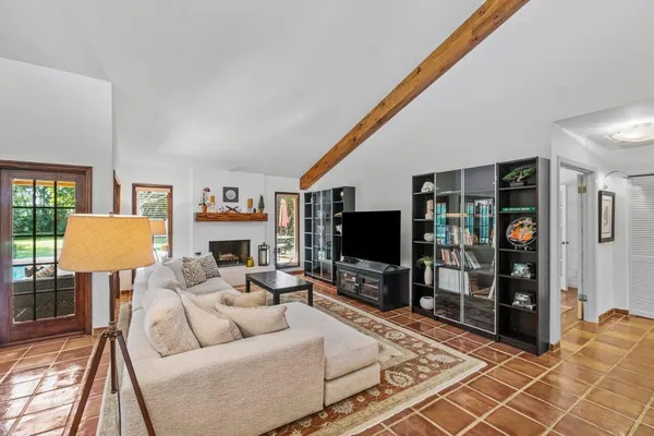 a living room with furniture and a flat screen tv