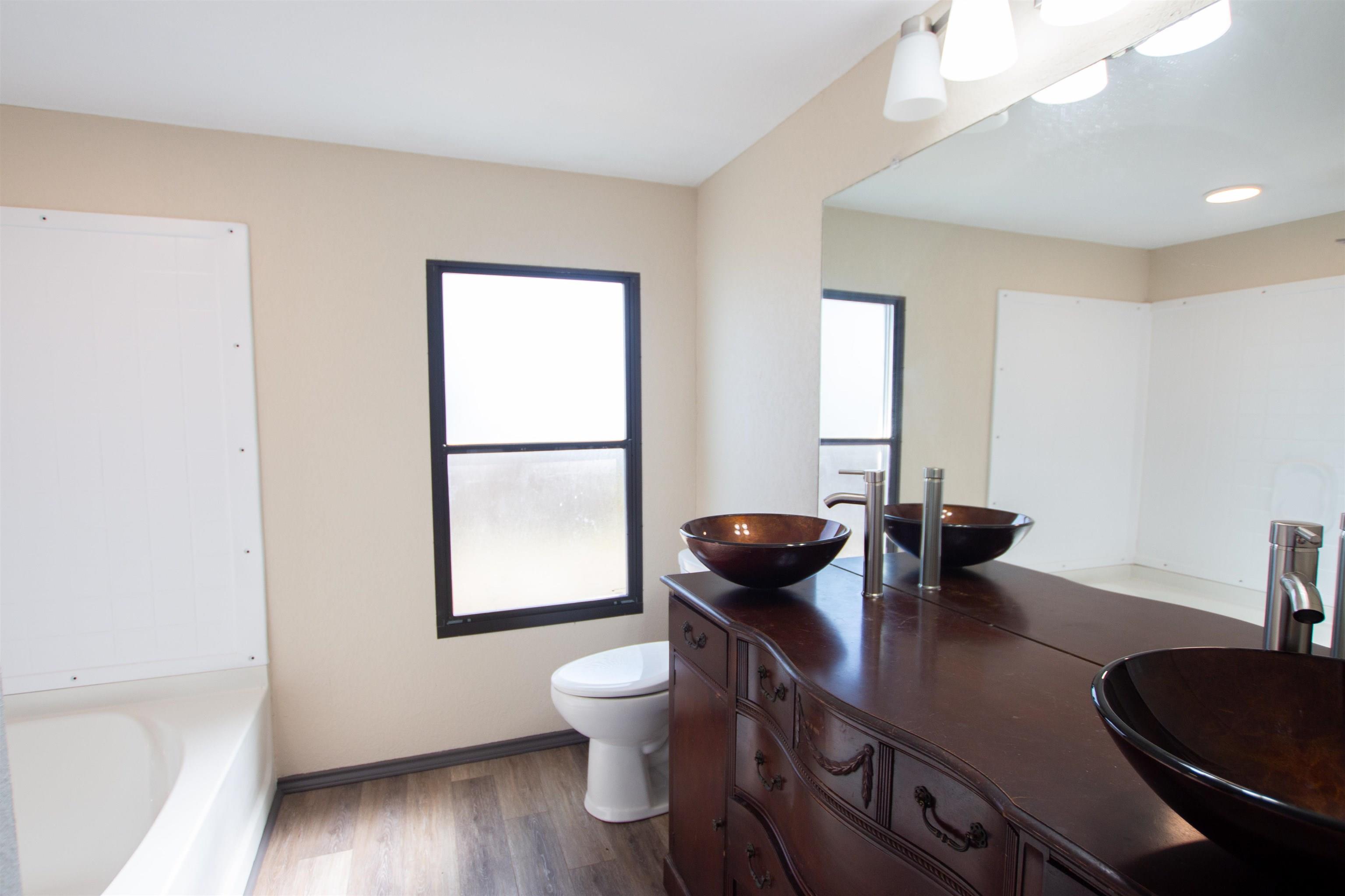 22908 Shell Shore Drive Bullard, TX 75757 - Photo 11 of 20 a living room with furniture and a wooden floor