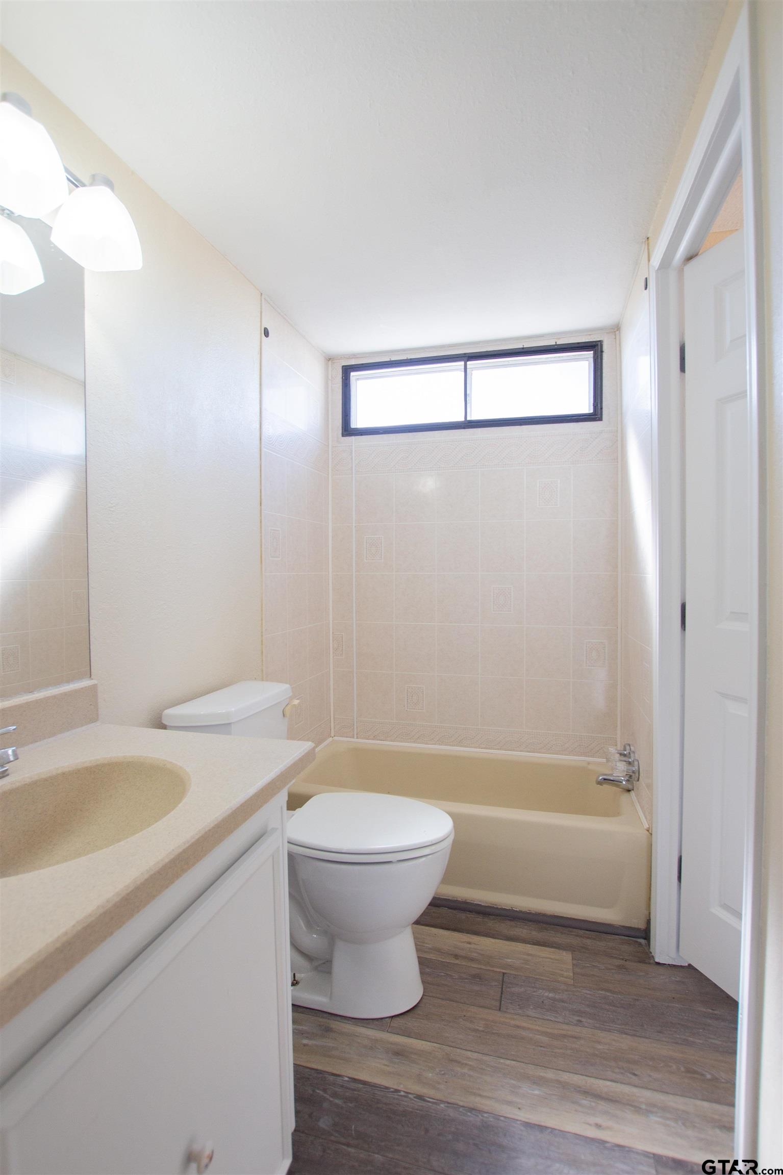 22908 Shell Shore Drive Bullard, TX 75757 - Photo 17 of 20 a bathroom with a sink a toilet and shower