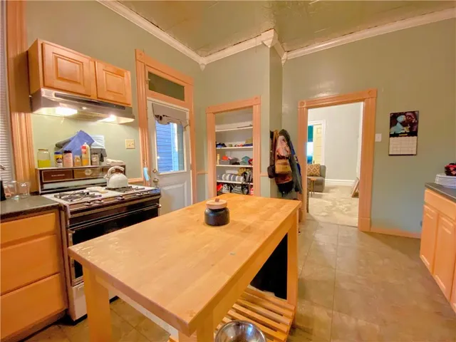 a kitchen with a stove and a refrigerator