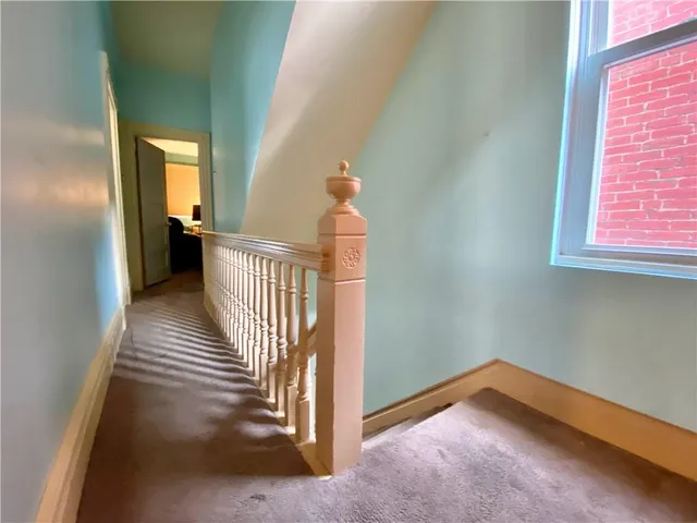 a view of a hallway view with staircase