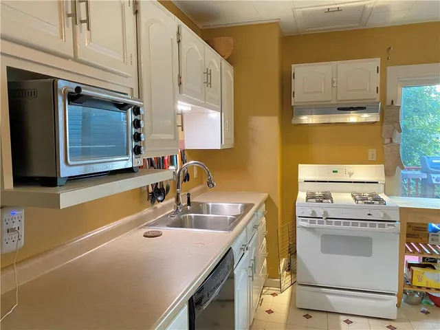 a bathroom with a sink and a washing machine