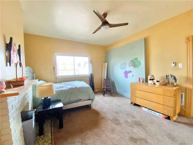 a bed room with a bed and a window