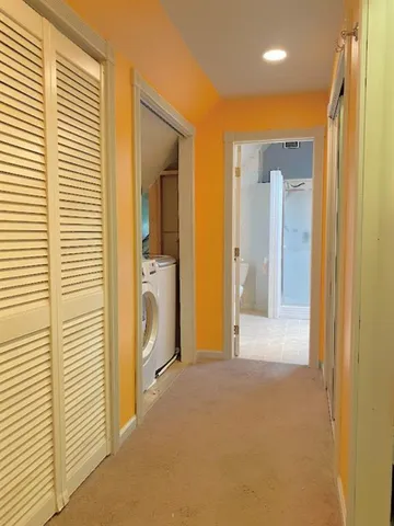 a view of a bathroom with a tub and shower