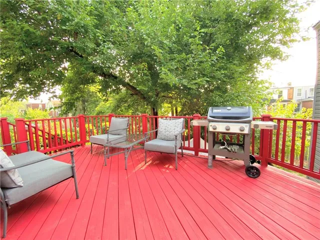 a outdoor view with sitting space and trees