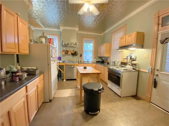 a kitchen with counter top space and appliances