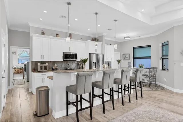 a room with furniture and a refrigerator