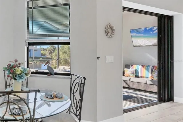 a spacious bedroom with a bed and a chandelier