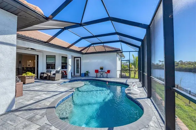 an aerial view of a house with a lake view