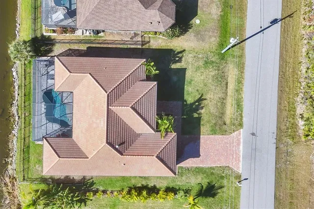an aerial view of a house with a garden