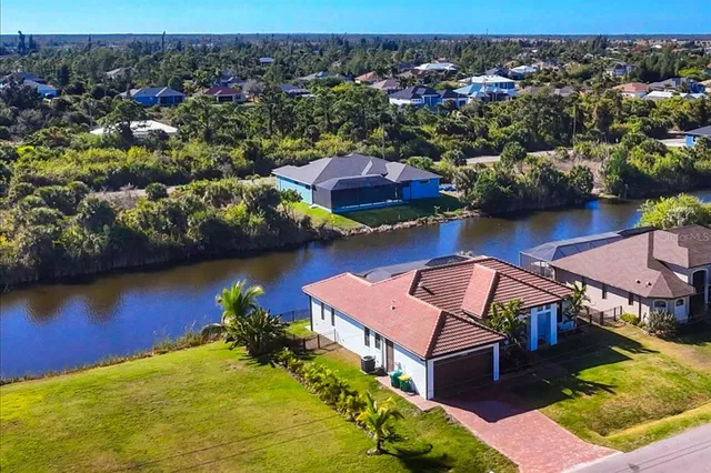 an aerial view of residential houses with outdoor space